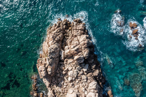 istock Drone view of blue ocean and rocks 1317811691