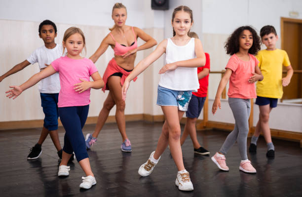 istock Tweens dancing with coach in choreography class 1317812109