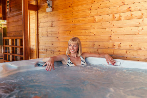 istock Woman relaxing in a hot tub 1317812169