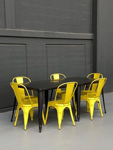 Detail from a modern cafe with yellow chairs