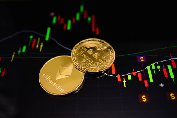Gold Ethereum coin (ETH) and gold Bitcoin coin (BTC) with a graph chart. Trading on the cryptocurrency exchange. Cryptocurrency Stock Market Concept. Gold Ethereum coin (ETH) and gold Bitcoin coin (BTC) with a graph chart. Trading on the cryptocurrency exchange. Cryptocurrency Stock Market Concept. altcoin photos stock pictures, royalty-free photos & images