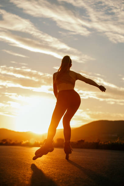 istock Young woman roller skating outdoors 1317813157