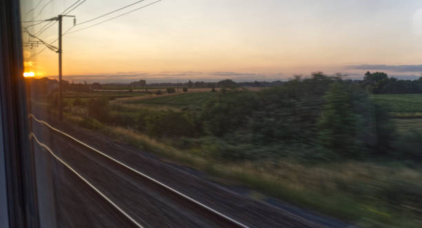 istock Sunset from a speeding train, blurred motion, Transportation and travel, vacations 1317816182