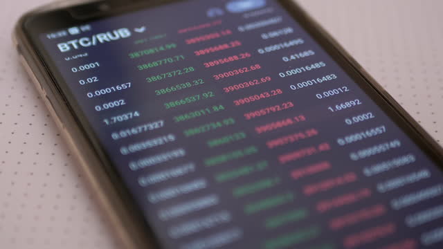 Stock Exchange, Cryptocurrency Price, Quotes, Numbers on of a Smartphone Screen