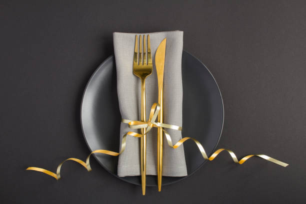 istock Top view of festive table setting on the black plate on  the black  background 1317817283