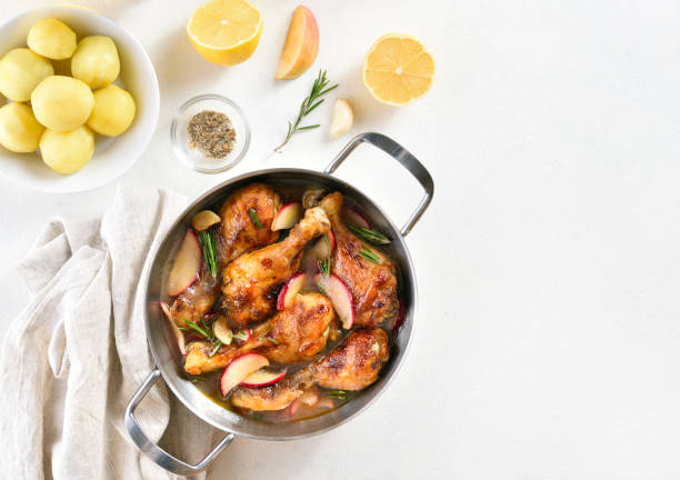 istock Chicken drumsticks baked with apples and herbs 1317819054