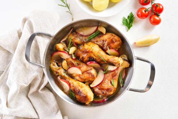 istock Chicken drumsticks baked with apples and herbs 1317819060