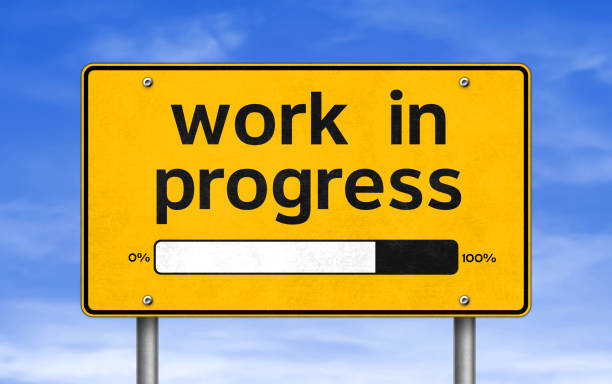road sign - work in progress road sign - work in progress incomplete stock pictures, royalty-free photos & images