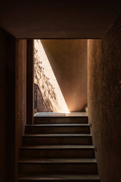 istock Walkway up staircase in soil wall with sunlight 1317821059