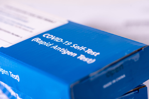 Packet of COVID-19 Rapid Antigen Test kits.  Also known as the Lateral Flow Test, the self test can be carried out in 30 minutes at home by people without symptoms to find out if they are carrying the virus.