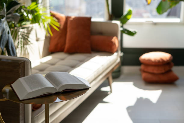istock Open book on coffee table in living room 1317825542