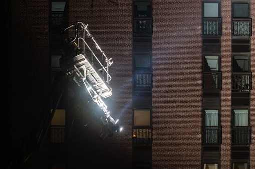Large Lights on a Filmset with Apartments in the Background