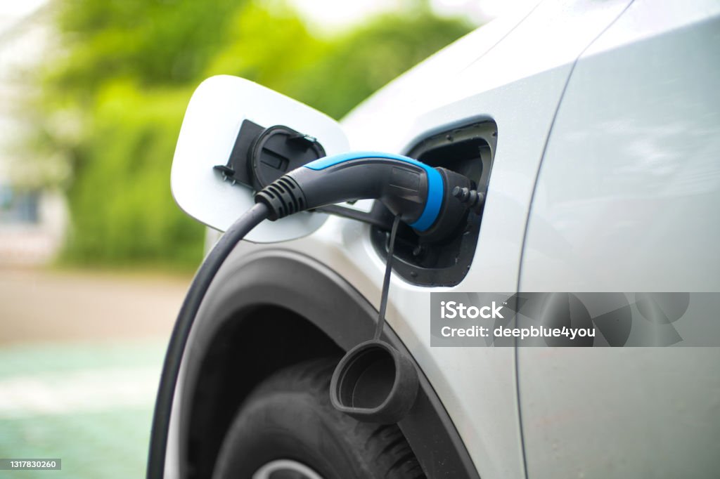 Electric Car Charging At Power Station Electric Car Stock Photo