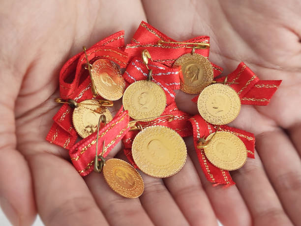 istock Turkish gold coins in hands 1317833955