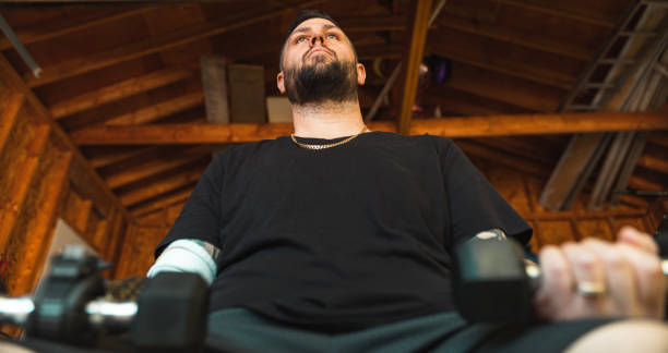 istock Man with disability working out in garage 1317837048