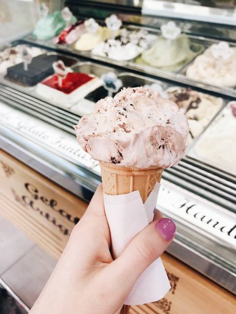 istock Hand holding Gelato ice cream cone 1317838531