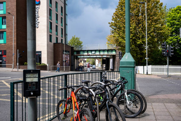 Bicylces With No People Chained Up On A Safety Barrier On A Main Road Crossroads Epsom Surrey London UK, May 02 2021, Bicylces With No People Chained Up On A Safety Barrier On A Main Road Crossroads surrey hotel southeast england england stock pictures, royalty-free photos & images