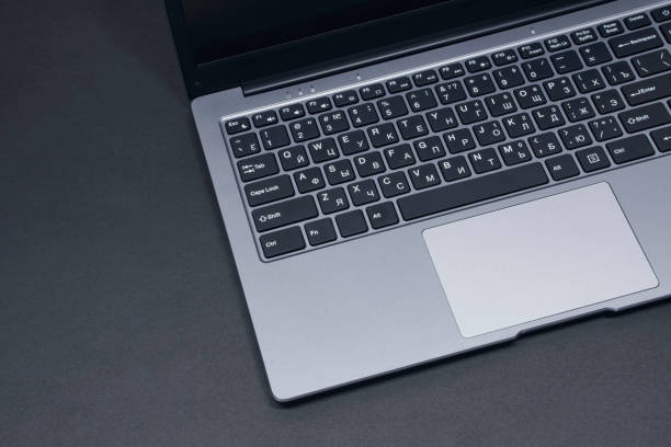 istock Open laptop on a black background close-up. 1317839989