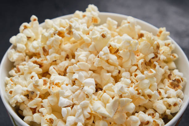 istock Close up delicious fresh buttery popcorn in a bowl 1317842184