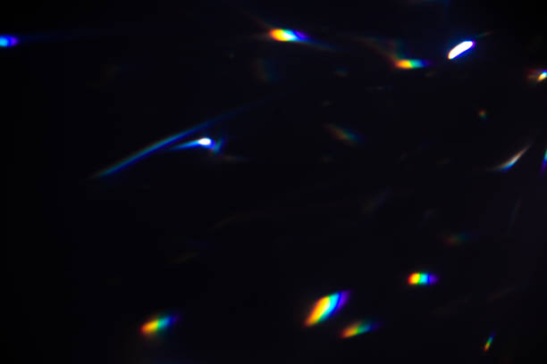 istock colorful warm rainbow crystal light leaks on black background 1317842620