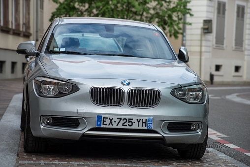 Mulhouse - France - 13 May 2021 - Front view of grey BMW 218 parked in the street