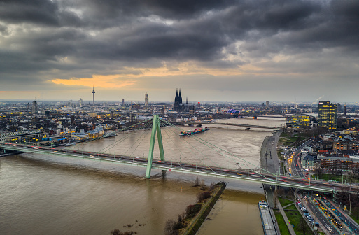 Aerial view of Cologne (Köln) in North Rhine Westphalia, Germany. Skyline with famous Cologne Cathedral and Television Tower in the background. Rhine river and Severin Bridge (Severinsbrücke) in the Background.