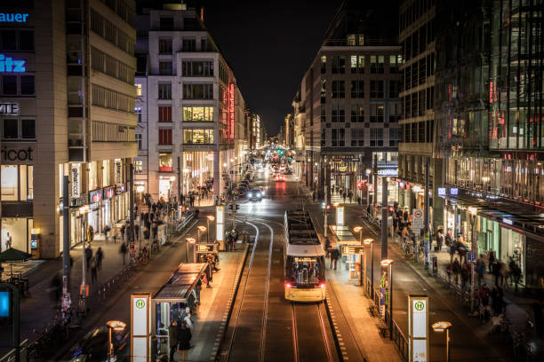 Friedrichstrasse in Berlin, Germany Friedrichstrasse (Frederick Street) Shopping Street a major culture and shopping street in central Berlin at night. Germany - Europe german people stock pictures, royalty-free photos & images