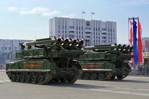 Khabarovsk, Russia - May 9, 2021:  Victory Day parade. Self-propelled Buk-M-1 surface-to-air missile ( SAM ) system. Khabarovsk, Lenin square, building of Khabarovsk Krai government. Far East, Russia.