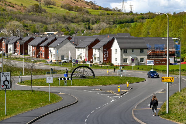 New housing development near Merthyr Tydfil in South Wales Merthyr Vale, Wales - May 2021: Entrance to a new housing development near Merthyr Tydfil. The houses are built on the site of an old colliery. merthyr tydfil stock pictures, royalty-free photos & images