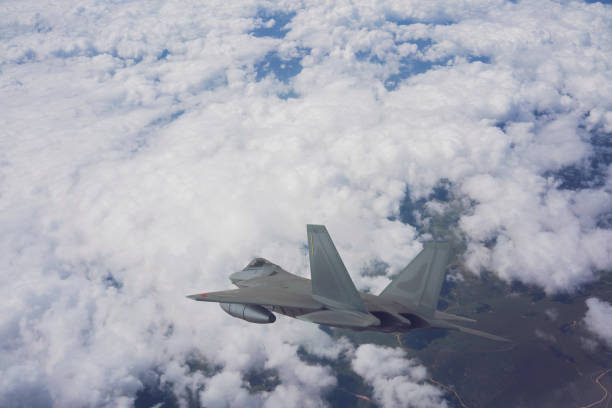 istock Jet fighters flying over the clouds. 1317846653