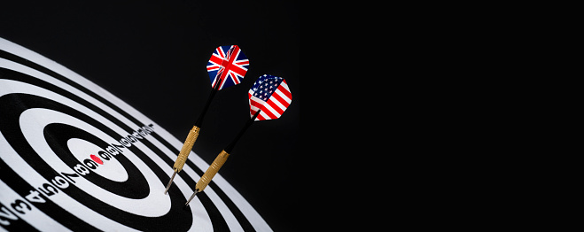darts with american an british flag on black background
