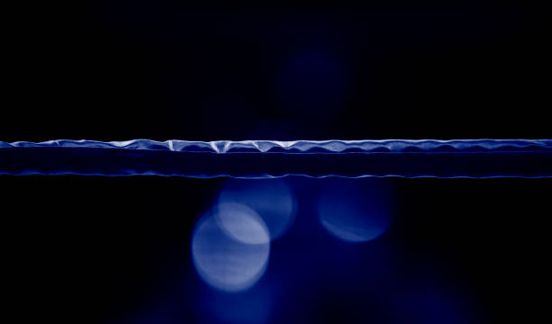 istock Boxing ring ropes with a blur spotlight. Blue color filter 1317849107