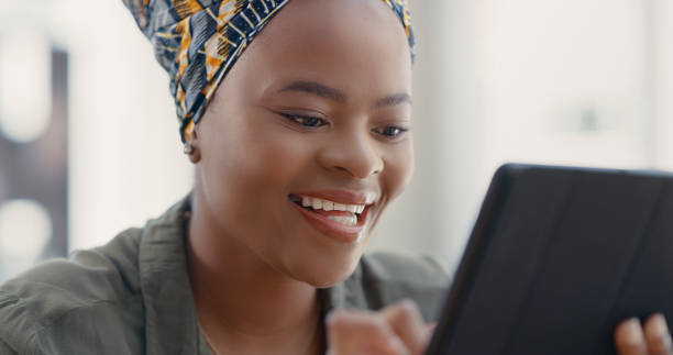istock Shot of a young woman using a digital tablet at home 1317853311