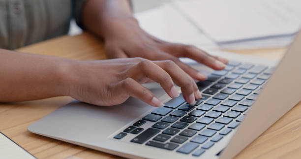 istock Closeup shot of a woman using a laptop while working from home 1317853425
