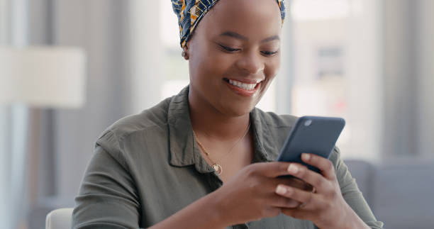 istock Shot of a young woman using a cellphone while working from home 1317853513
