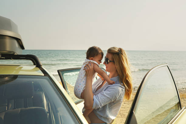 istock Happy young single mother with baby on vacation 1317855708