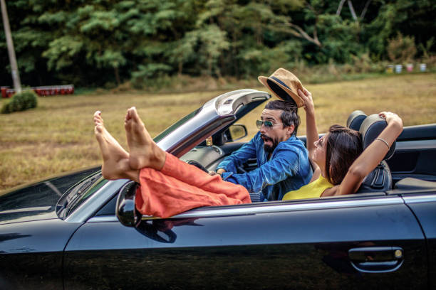 istock Frustrated Man Looking At Relaxed Woman Driver 1317856315