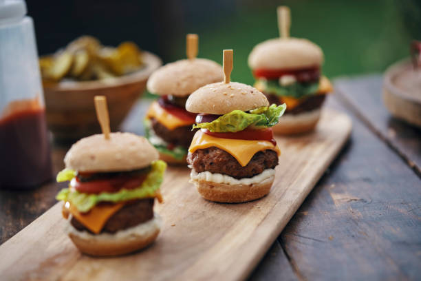 istock Mini Burgers with Beef Pattie, Tomato, Pickles and Lettuce 1317858270