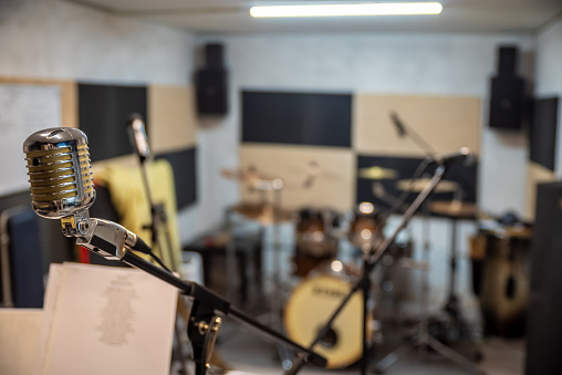 A view of a drum kit set up for recording in a recording studio with microphones in place