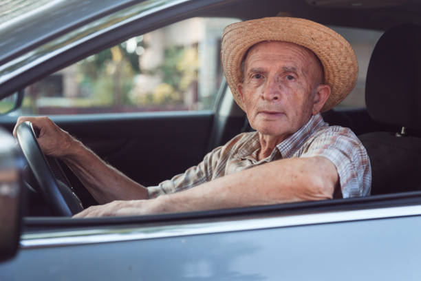 istock Elderly farmer sitting comfortably in his car 1317866050