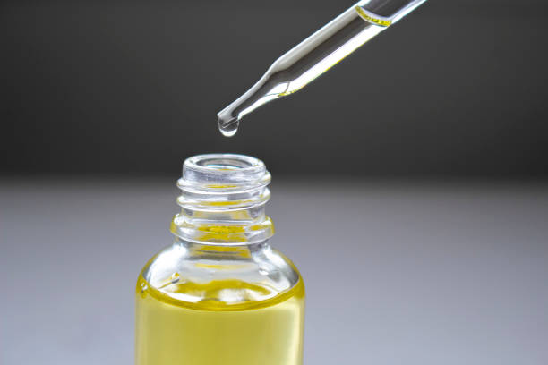 istock Dropping cannabis oil on an transparent bottle. 1317868072