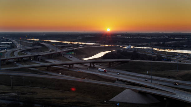 istock Freeway Interchange with Sun at Horizon - Aerial 1317870594