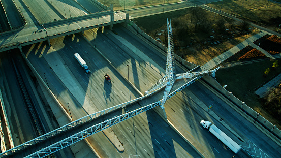 Aerial establishing shot of Scissortail Bridge in Oklahoma City on a sunny morning in winter.
