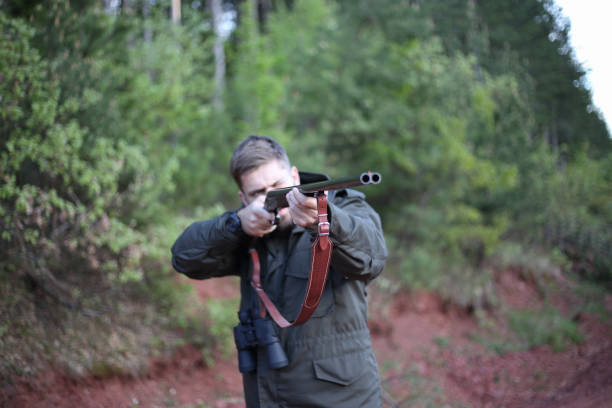 istock Man holding gun stock photo 1317871986