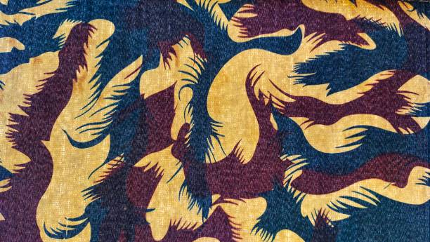 istock Army of military camouflage pattern design on a fabric 1317874184