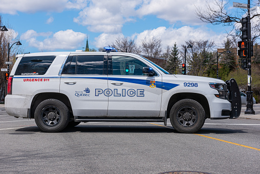 Quebec city, Quebec, Canada – 2 may 2021 : Quebec city police car in the middle of a street of the Old Limoilou district