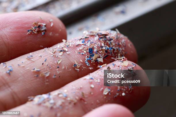 Close Up Side Shot Of Microplastics Lay On People Handconcept Of Water Pollution And Global Warming Climate Change Idea Stock Photo - Download Image Now