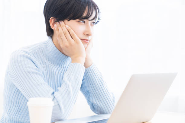 istock young asian woman using laptop,think, 1317883718