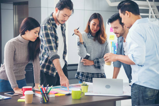 istock Creative design office center working teamwork. Happy business people partner plan strategy organization research people together at diversity office using laptop, smartphone company conference room 1317883881