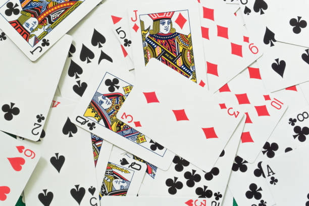 istock Playing cards on green background. 1317886353